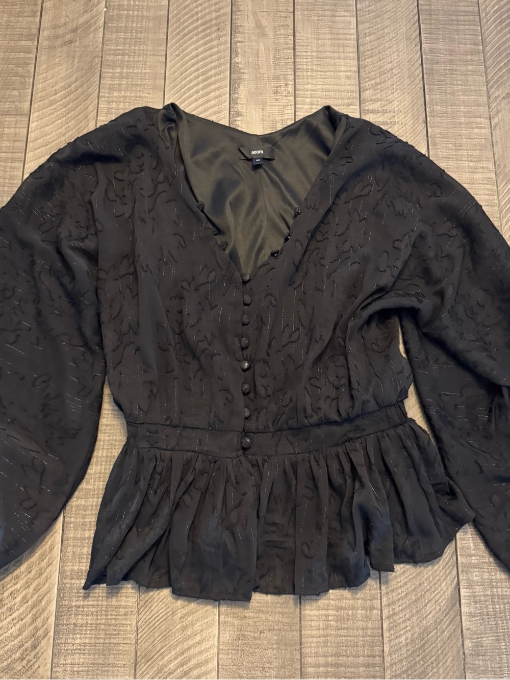 Aeom Black Textured Button-Front Peplum Blouse